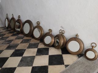 Espejos dorados de latón