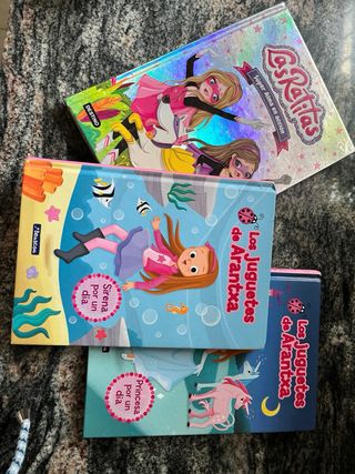 Juguete portabebes , libros infantilesy bolso niña