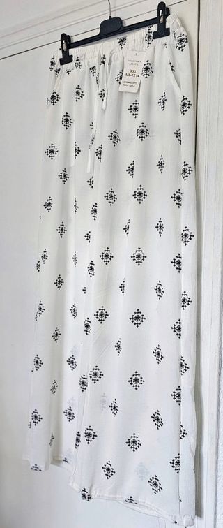 Pantalón fluído acampanado mujer