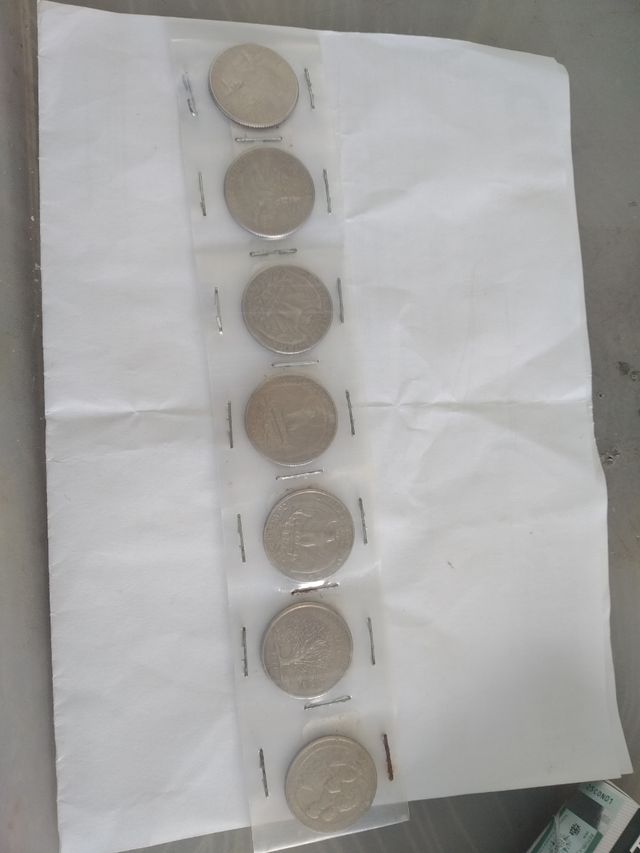 7 moedas de 0,25 de dollar 