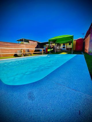 Alquiler de parcela con piscina y casa 