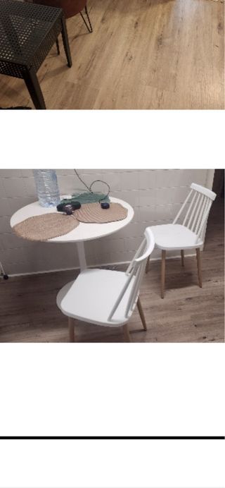 Mesa redonda blanca y dos sillas
