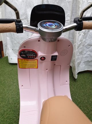 Moto electrica infantil con su caja