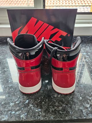 A RETAIL JORDAN 1 RETRO HIGH OG PATENT BRED