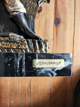 Figura de marinero de bronce