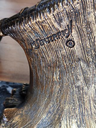 Figura de marinero de bronce