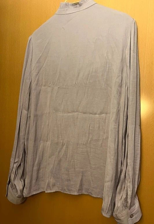 blusa cuello bolantes cisne de Sfera, M. lila