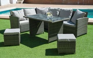 Divano ad angolo in rattan + tavolino + 2 pouf