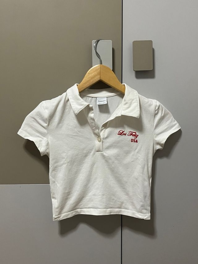 T-shirt polo bianca stretta e corta Taglia S