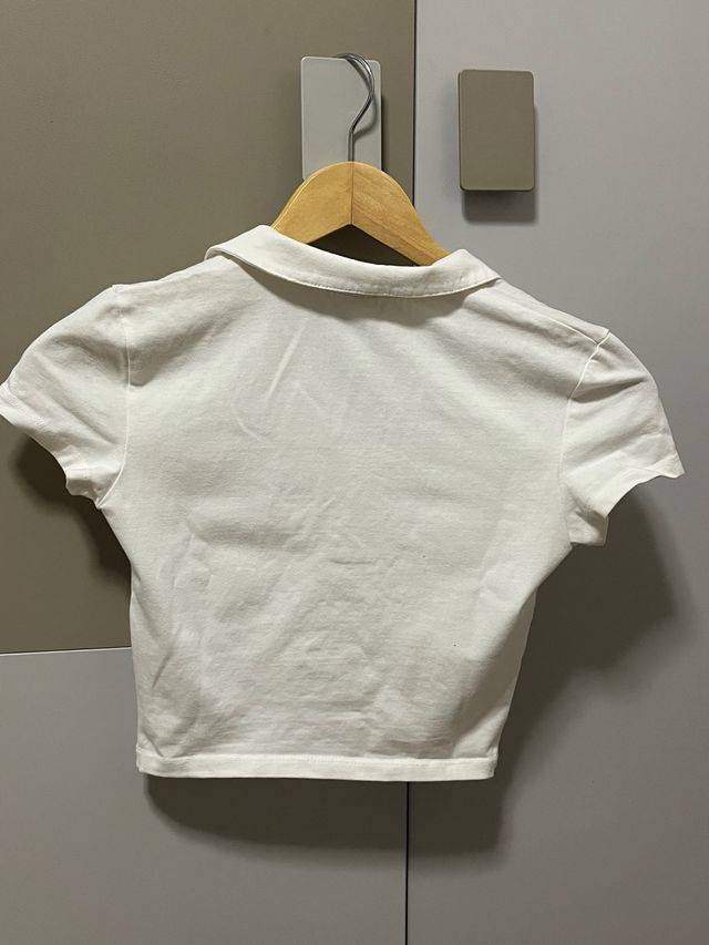 T-shirt polo bianca stretta e corta Taglia S