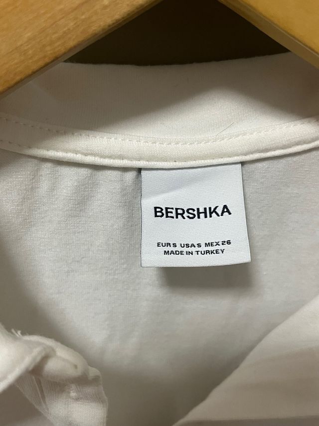 T-shirt polo bianca stretta e corta Taglia S