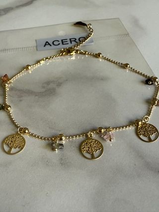 Tobillera de acero dorado y arbol de la vida