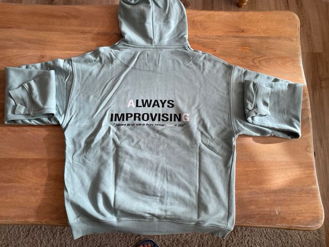 Sudadera azul verdoso con capucha. Talla XL