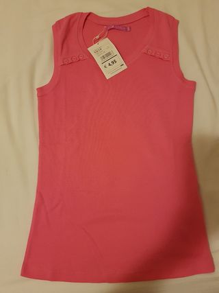 Maglietta / Canotta   senza maniche rosa fucsia.
