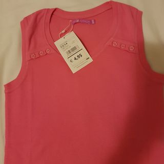 Maglietta / Canotta   senza maniche rosa fucsia.