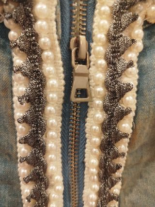 Torera tejana con ornamentos en mangas.