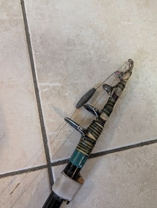 Canna da pesca vintage con mulinello