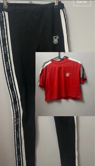 Conjunto Siksilk: Leggings negros y top rojo.