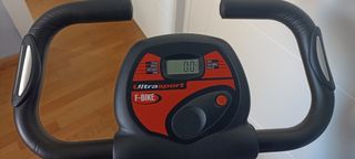 Bicicleta estática plegable con sillín acolchado