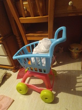 Carro compra juguete rosa ,5€ cada uno