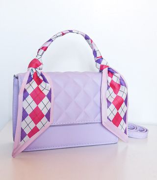 Bolso morado acolchado