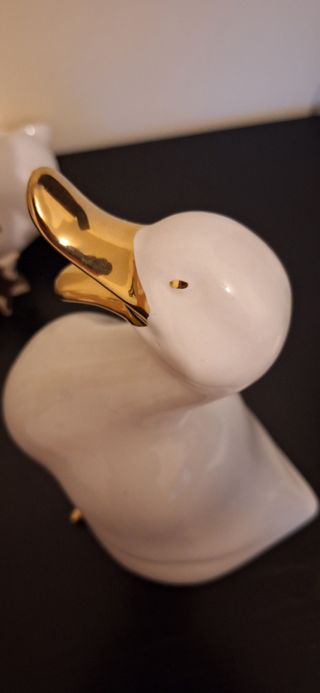 2 Patos porcelana dorados