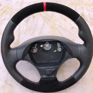 Volante deportivo tapizado