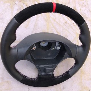 Volante deportivo tapizado