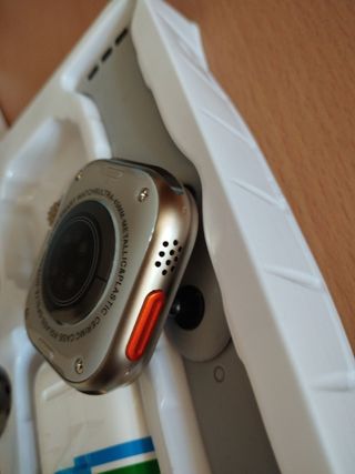 Smartwatch dorado y gris + auriculares
