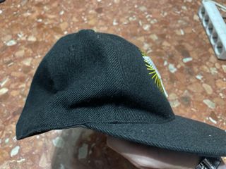 Gorra Grimey negra y dorada