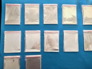 12 Confezioni -- 100 Bustine Plastificate -- Carte