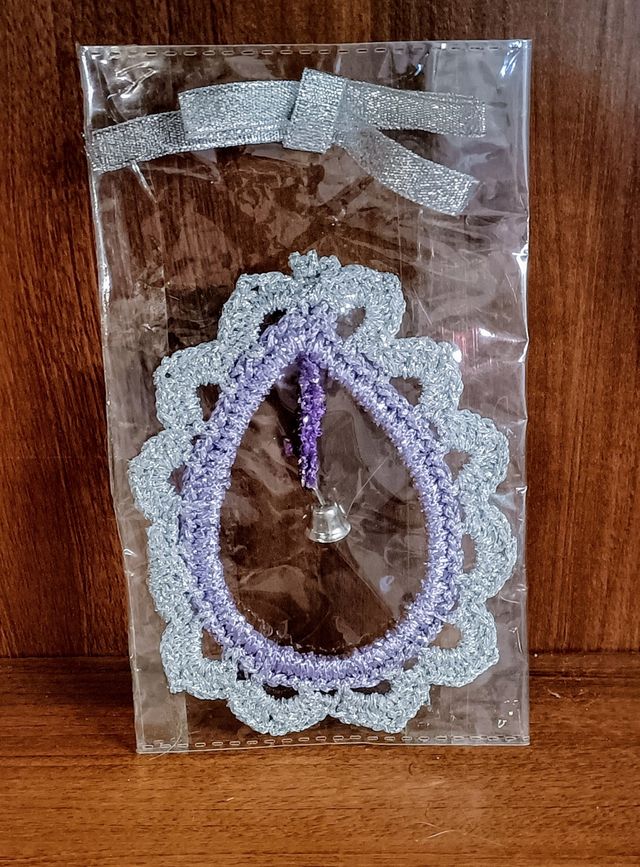 Decoro in pizzo con campanellino