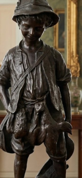 Figura de bronce niño cazador
