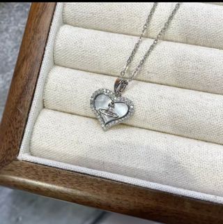 Collana argento cuore madreperla. Non è originale