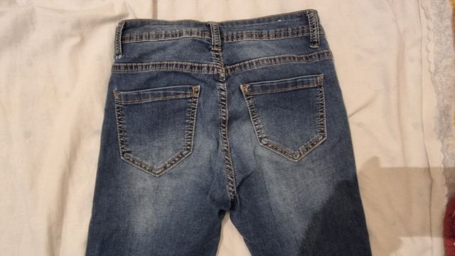 Jeans skinny strappati blu