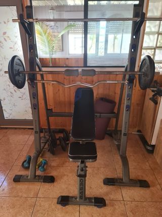 Banco multipower con discos y barras