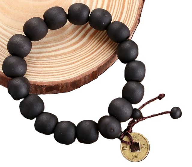 BRACCIALE NERO LEGNO BUDDAH CON MONETA CINESE