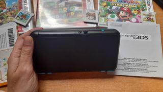 Nintendo 2DS XL funda y juegos