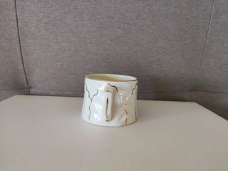 Taza ceramica blanca filos dorados