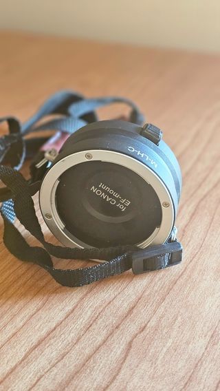 Arnés para objetivos Canon