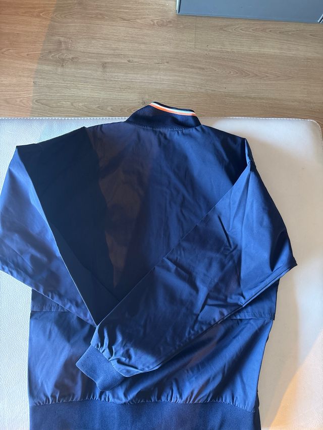 Chubasquero lacoste roland garros