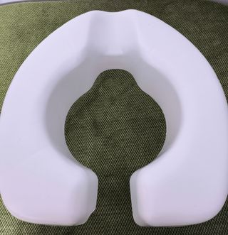 Asiento elevador inodoro