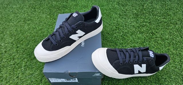 Zapatillas New Balance 100 - Negras y Blancas