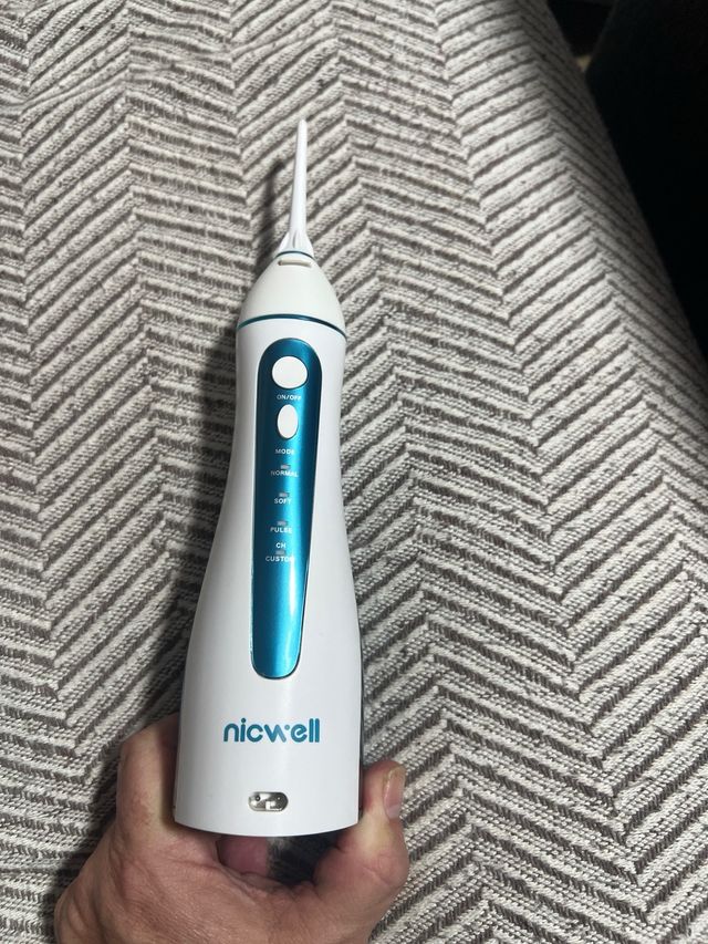 Irrigador dental nicwell