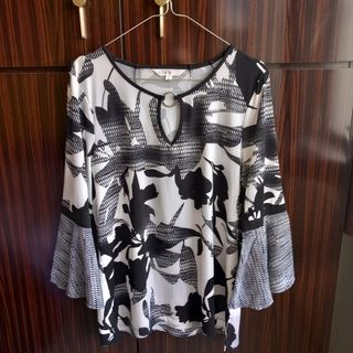 Blusa Cleo taglia L, bianca e nera.