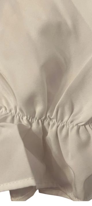 Blusa blanca drapeada manga larga
