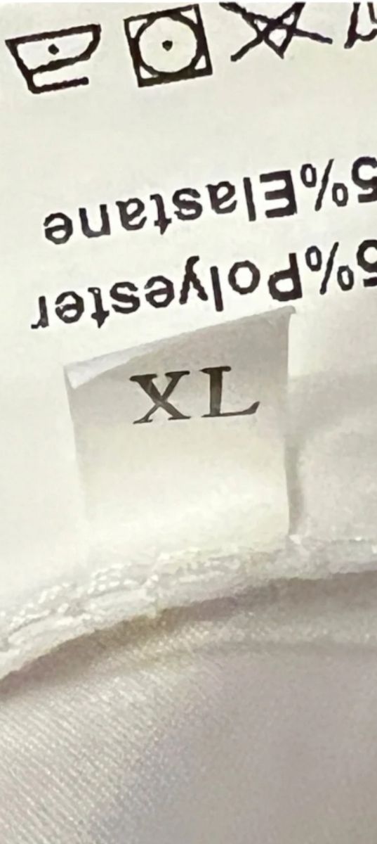 Blusa blanca drapeada manga larga