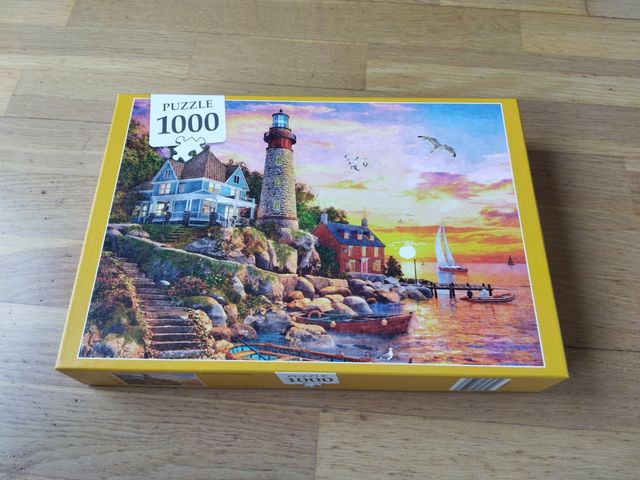 Puzzle 1000 peces Far i posta de sol