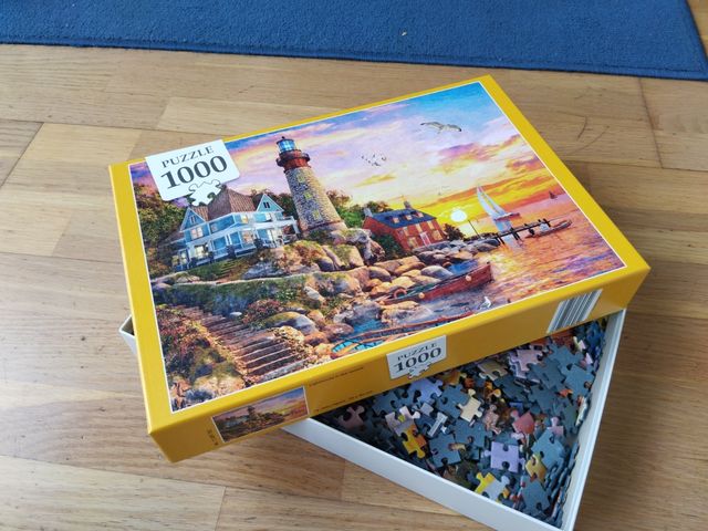 Puzzle 1000 peces Far i posta de sol