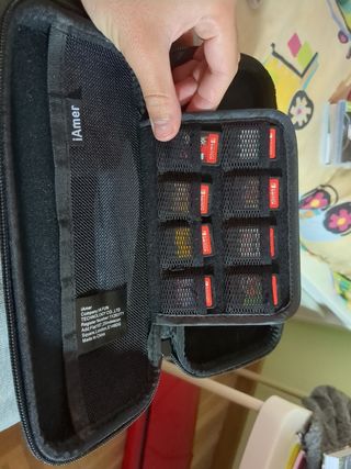 Nintendo switch lite con juegos ,funda y cargador